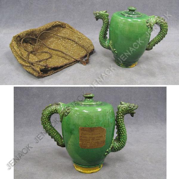CHINESE GREEN GLAZED PUZZLE POT WITH DRAGON, YUAN: CHINESE GREEN GLAZED PUZZLE POT WITH DRAGON, YUAN. HEIGHT 6 1/2" WITH CLOTH BAG EX: COLLECTION BEN BIRILLO (COLLECTOR LABEL ATTACHED)