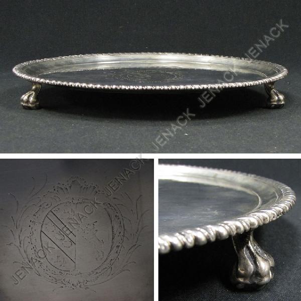 STERLING FOOTED SALVER WITH ARMORIAL CREST: STERLING FOOTED SALVER WITH ARMORIAL CREST, ASSAY STAMPED (3X) JOHN PARKER AND ED WARD WAKELIN (1760-1776). DIAMETER 9 1/2"; 17.30 OZT (SOLDER REPAIR ON CLAW/BALL FEET)