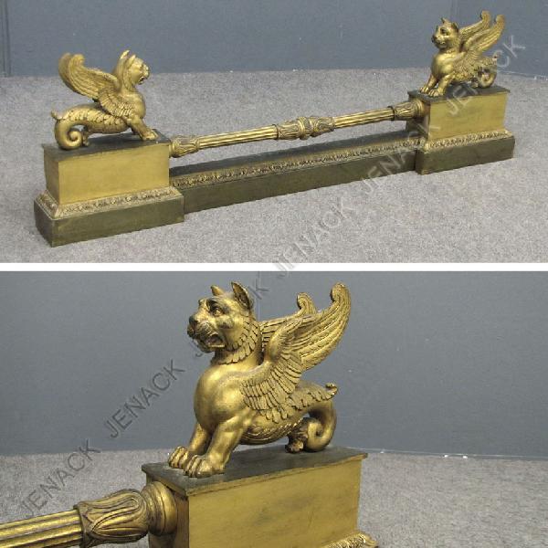 REGENCY PARCEL GILT BRASS/BRONZE FIREPLACE FENDER: REGENCY PARCEL GILT BRASS/BRONZE ADJUSTABLE FIREPLACE FENDER. HEIGHT 12"; LENGTH 43"