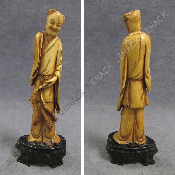 CHINESE CARVED IVORY FIGURE OF A SMILING MONK: CHINESE CARVED IVORY FIGURE OF A SMILING MONK WITH CARVED HORN STAND. HEIGHT 7" **CANNOT EXPORT IVORY**