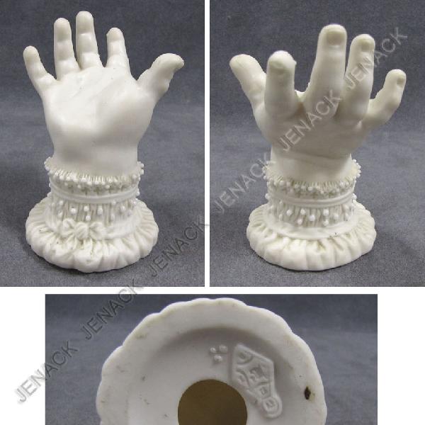 ENGLISH PARIAN INFANT HAND RING STAND: ENGLISH PARIAN INFANT HAND RING STAND, 19TH CENTURY. HEIGHT 3 3/4"