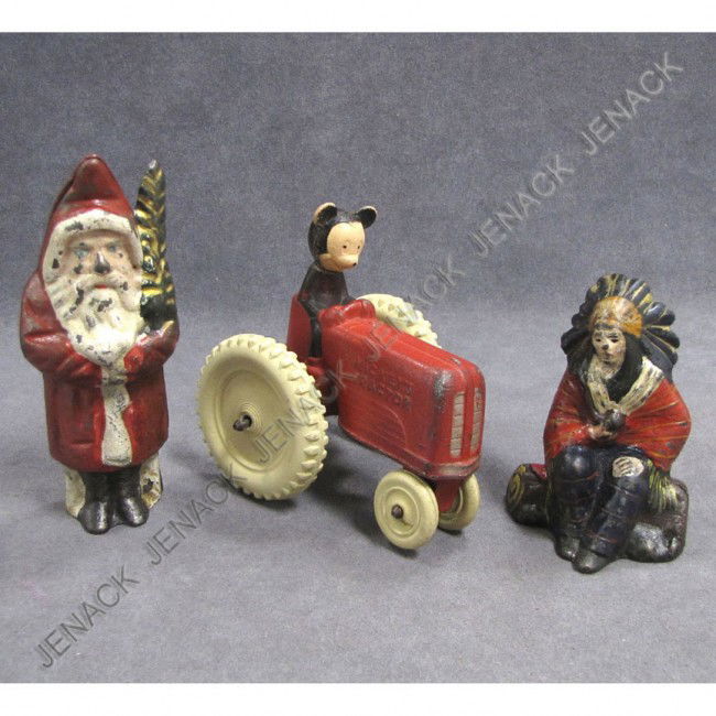 LOT (3) CAST IRON INCLUDING WALT DISNEY'S MICKEY'S: LOT (3) CAST IRON INCLUDING WALT DISNEY'S MICKEY'S TRACTOR AND (2) STILL BANKS, SANTA WITH TREE AND SEATED INDIAN CHIEF