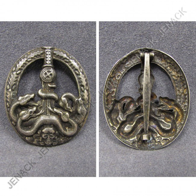 GERMAN WWII TOMBAK ANTI-PARTISAN WAR BADGE: GERMAN WWII TOMBAK ANTI-PARTISAN WAR BADGE, 1944-45 (TYPE A)