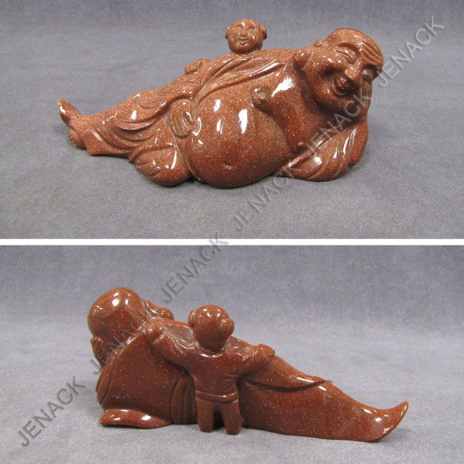 CHINESE GOLD STONE FIGURE OF RECLINING BUDDHA: CHINESE CARVED GOLD STONE FIGURE OF RECLINING BUDDHA. HEIGHT 2 1/2"; LENGTH 5 3/4"