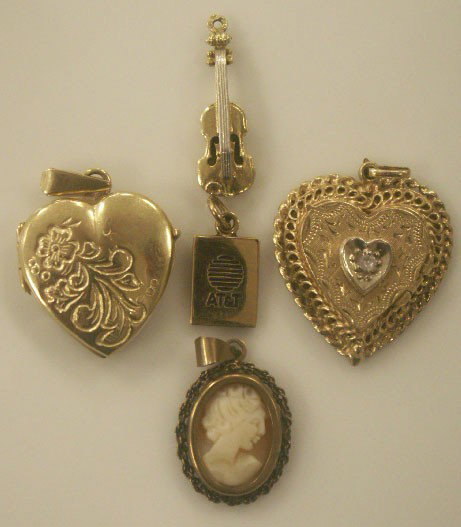 LOT (5) CHARMS INCLUDING (2) 14K CLOCK AND VIOLIN: LOT (5) CHARMS INCLUDING (2) 14K CLOCK AND VIOLIN, (2) 10K AT&T AND HEART LOCKET, AND 9K FRAMED CAMEO. GW 19.62 GRAMS