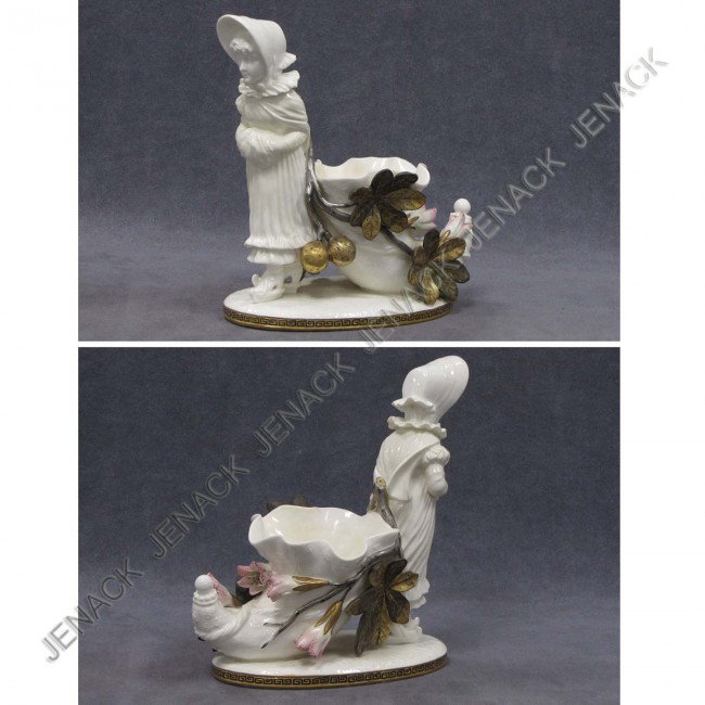 VICTORIAN PORCELAIN FIGURE GIRL ON SKATES: VICTORIAN PORCELAIN FIGURE GIRL ON SKATES PULLING CORNUCOPIA, SIGNED MOORE (BLACK MARK). HEIGHT 8 1/2"; WIDTH 8"