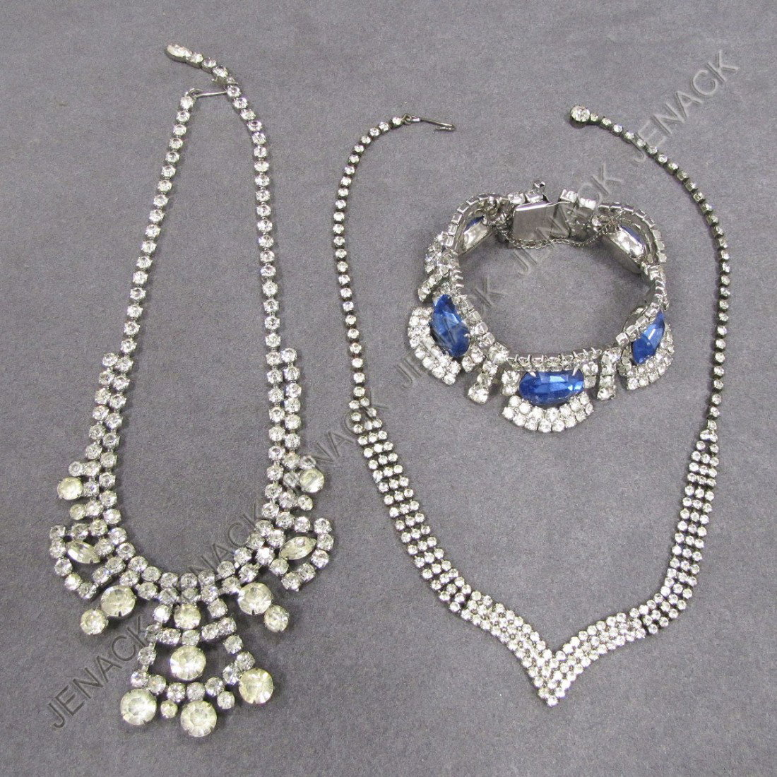 LOT (3) RHINESTONE AND SILVER TONE FASHION JEWELRY: LOT (3) RHINESTONE AND SILVER TONE FASHION JEWELRY INCLUDING BRACELET WITH BLUE PASTE STONES, SIGNED KRAMER OF NEW YORK AND (2) NECKLACES. BRACELET/LENGTH 7"