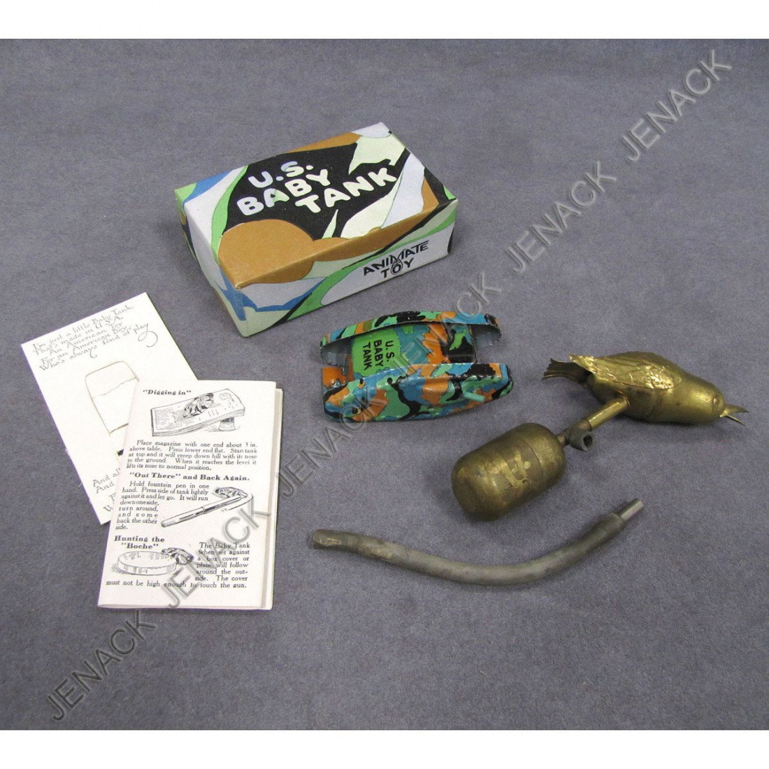 LOT (2) INCLUDING BRASS MECHANICAL BIRD AND VINTAG: LOT (2) INCLUDING BRASS MECHANICAL BIRD AND VINTAGE US BABY TANK ANIMATED TOY, C.1916 WITH ORIGINAL BOX AND PAPERS
