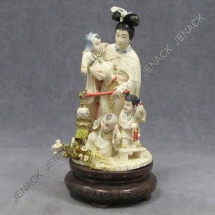 CHINESE CARVED/STAINED IVORY FIGURE OF A WOMAN: CHINESE CARVED/STAINED IVORY FIGURE OF A WOMAN WITH CHILDREN. HEIGHT 10 1/2" **CANNOT EXPORT IVORY**