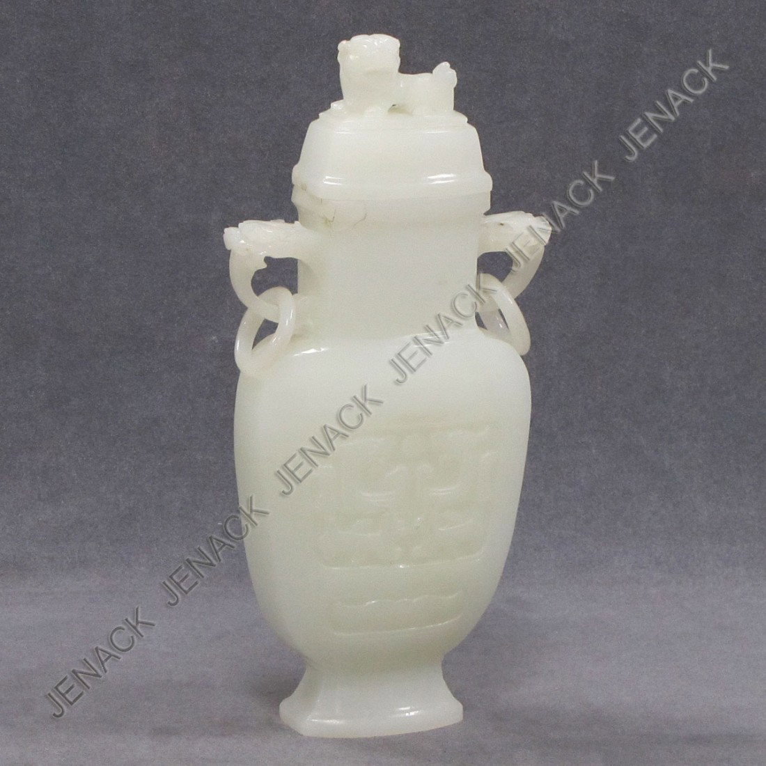 CHINESE ARCHAIC-FORM CARVED STONE COVERED JAR: CHINESE ARCHAIC-FORM CARVED WHITE HARD STONE COVERED JAR. HEIGHT 11"