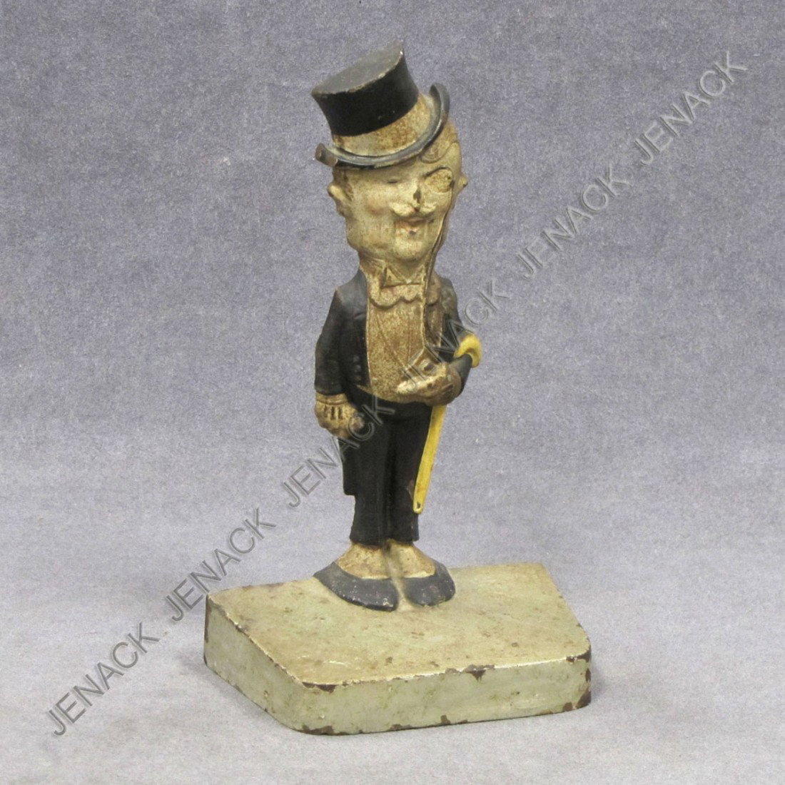 VINTAGE CAST IRON PAINTED DAPPER DAN DOORSTOP: VINTAGE CAST IRON PAINTED DAPPER DAN DOORSTOP, #217, J. HELD JR. HEIGHT 7 5/8"; WIDTH 4 3/8"