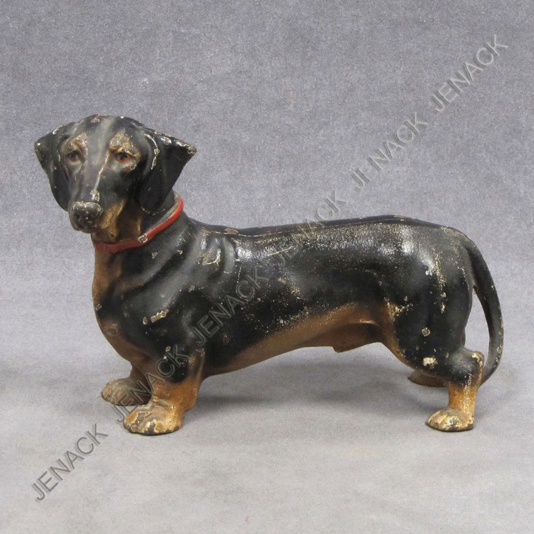 VINTAGE CAST IRON PAINTED DACHSHUND DOORSTOP: VINTAGE CAST IRON PAINTED DACHSHUND DOORSTOP, MADE IN USA. HEIGHT 6"; LENGTH 9 1/2"