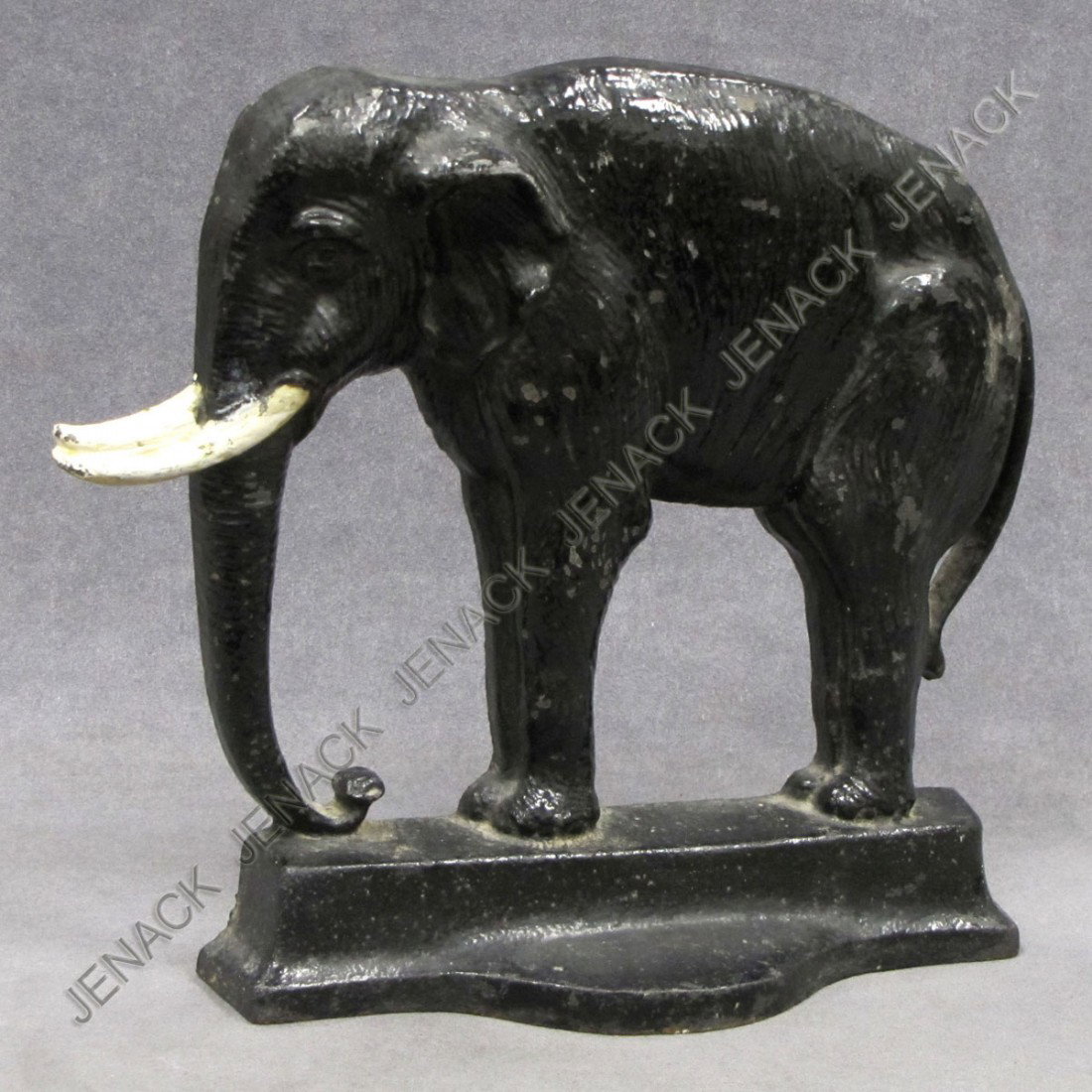 BRADLEY & HUBBARD CAST IRON ELEPHANT DOORSTOP: BRADLEY & HUBBARD CAST IRON PAINTED ELEPHANT DOORSTOP, SIGNED B&H, #7799. HEIGHT 10 1/4"; WIDTH 9 1/4"