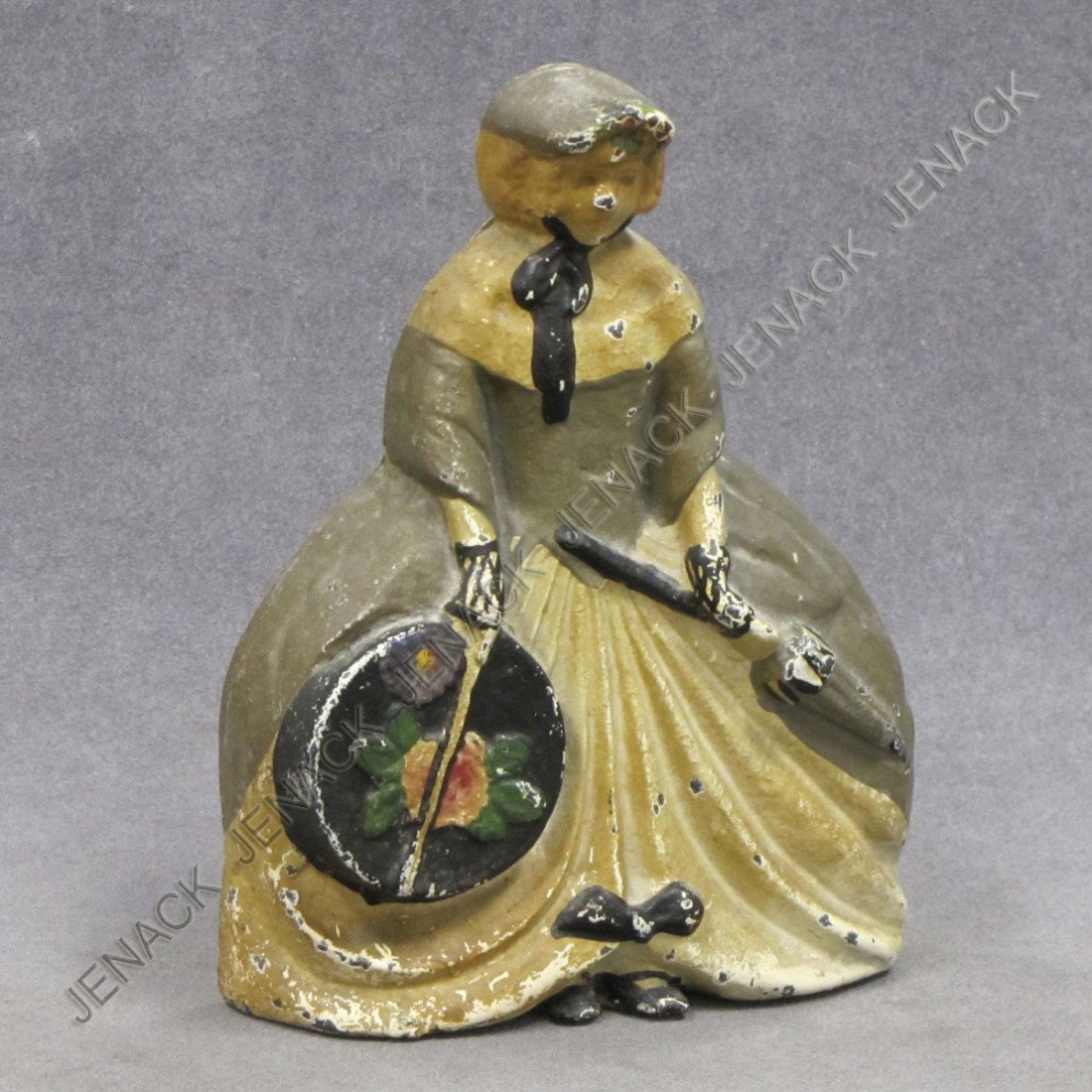 VINTAGE CAST IRON PAINTED DOORSTOP, VICTORIAN LADY: VINTAGE CAST IRON PAINTED DOORSTOP, VICTORIAN LADY WITH HAT BOX, #30. HEIGHT 6 3/4"; WIDTH 5 1/4"