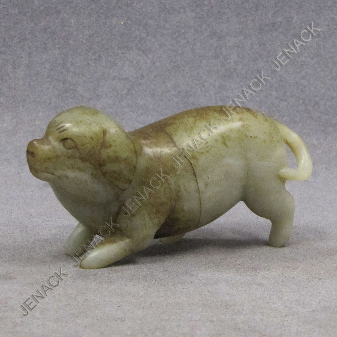CHINESE CARVED GREEN JADE DOG: CHINESE CARVED GREEN JADE DOG. LENGTH 4 1/4"