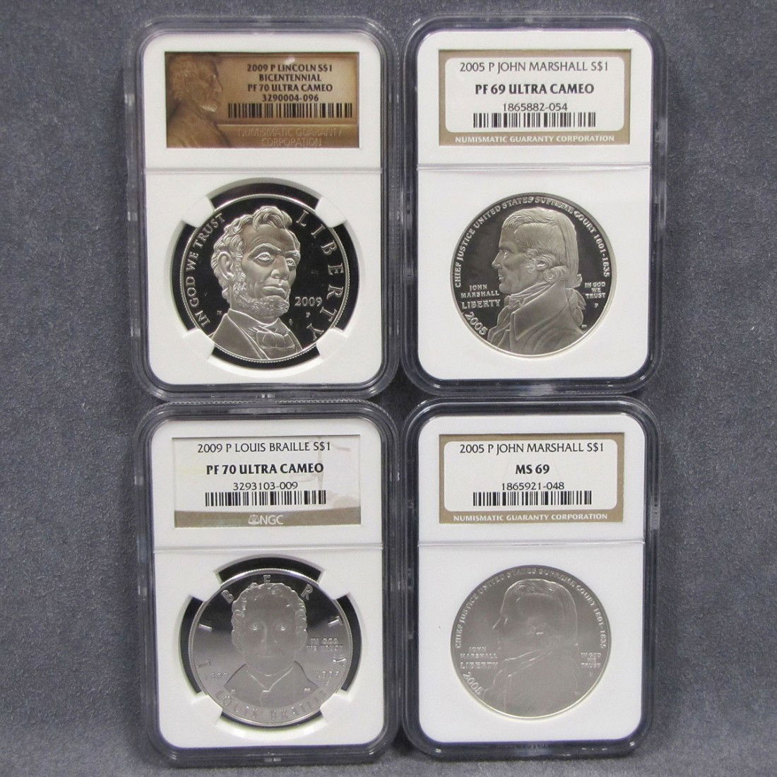 LOT (4) ASSORTED COMMEMORATIVE SILVER DOLLAR COINS: LOT (4) ASSORTED COMMEMORATIVE SILVER DOLLAR COINS INCLUDING 2005 JOHN MARSHALL NGC (MS 69); 2005 P JOHN MARSHALL NGC (PF 69 ULTRA CAMEO); 2009 P LOUIS BRAILLE NGC (PF 70 ULTRA CAMEO); 2009 P LINCOLN