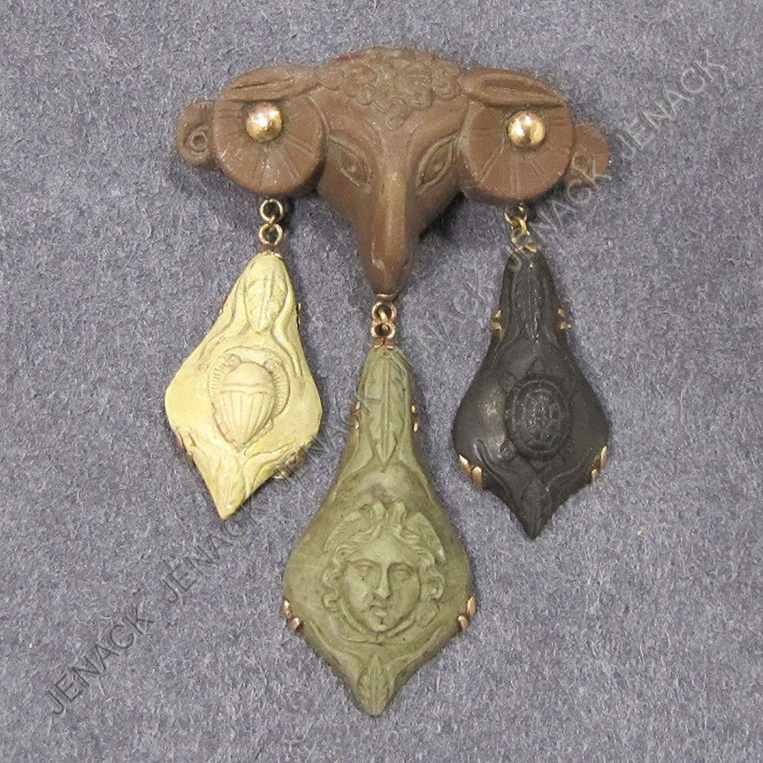 ANTIQUE CARVED LAVA STONE PIN: ANTIQUE CARVED LAVA STONE AND PINK GOLD (TESTS 14K) PIN. 2 1/4 X 1 1/2"