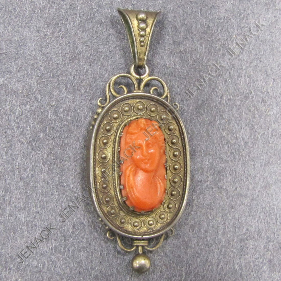 VICTORIAN GILT SILVER AND CARVED CORAL CAMEO: VICTORIAN GILT SILVER AND CARVED CORAL CAMEO HAIR LOCKET PENDANT. LENGTH 2 1/2"; 0.31 OZT