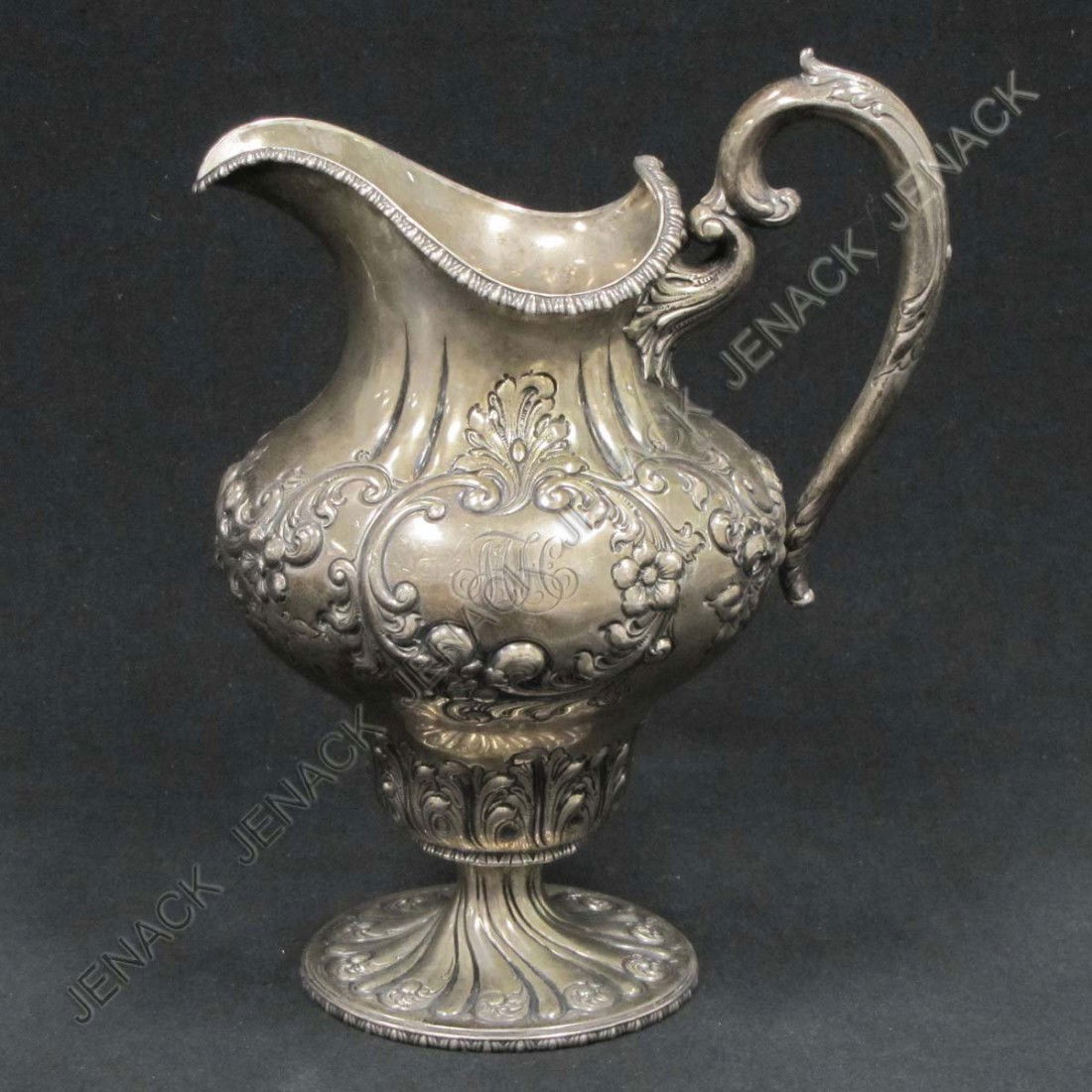 FRANK SMITH STERLING REPOUSSE PITCHER, #1130B: FRANK SMITH STERLING REPOUSSE PITCHER, #1130B, MONOGRAMMED, RETAILED BY BAILEY, BANKS & BIDDLE. HEIGHT 10 1/2"; 26.45 OZT