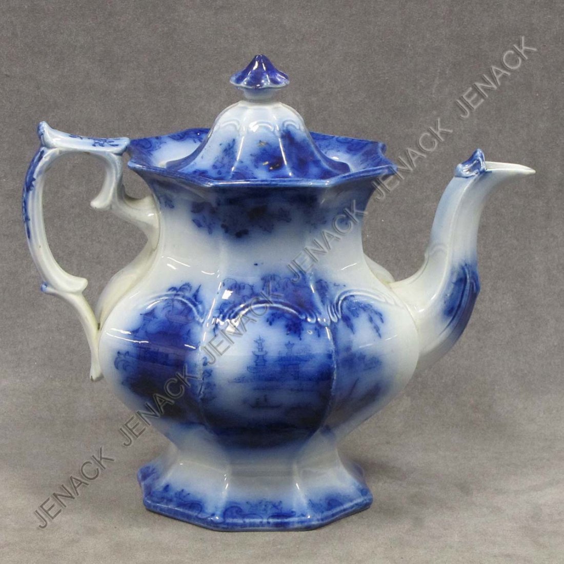 VICTORIAN FLOW BLUE DECORATED IRONSTONE COFFEE POT: VICTORIAN FLOW BLUE DECORATED IRONSTONE COFFEE POT, 19TH CENTURY. HEIGHT 9 1/2"
