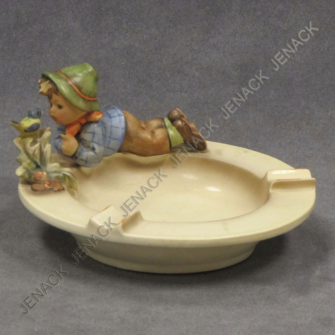 HUMMEL PORCELAIN FIGURE, BOY WITH BIRD ASHTRAY: HUMMEL PORCELAIN FIGURE, BOY WITH BIRD ASHTRAY, TMK 1 & 2, #166. HEIGHT 3"