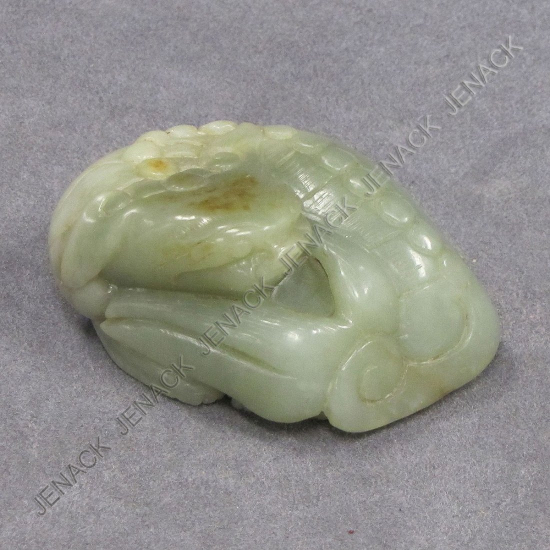 CHINESE CARVED JADE RECUMBENT FOO DOG: CHINESE CARVED JADE RECUMBENT FOO DOG. HEIGHT 1 1/4"; LENGTH 3 1/2"