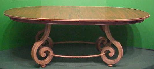 REGENCY STYLE DINING TABLE: REGENCY STYLE ROSEWOOD/WROUGHT IRON BASE DINING TABLE WITH (2) 18" LEAVES. HEIGHT 30"; TOP 46 X 84" (FEW NICKS) **DUE TO THE SIZE AND/OR FRAGILITY OF THIS LOT, STANDARD IN-HOUSE SHIPPING IS NOT AVAILA
