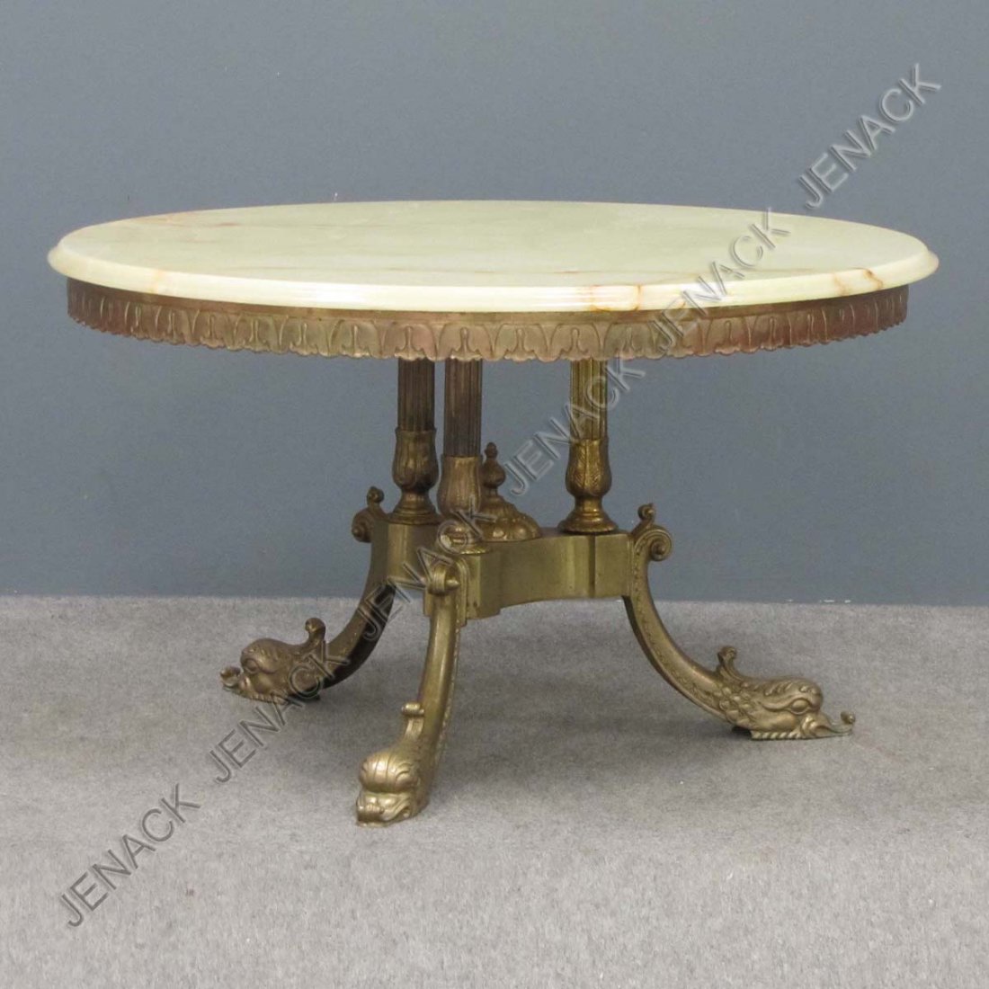 REGENCY STYLE BRASS BASE LOW TABLE WITH ONYX TOP: REGENCY STYLE BRASS BASE LOW TABLE WITH ONYX TOP. HEIGHT 19"; DIAMETER 32"