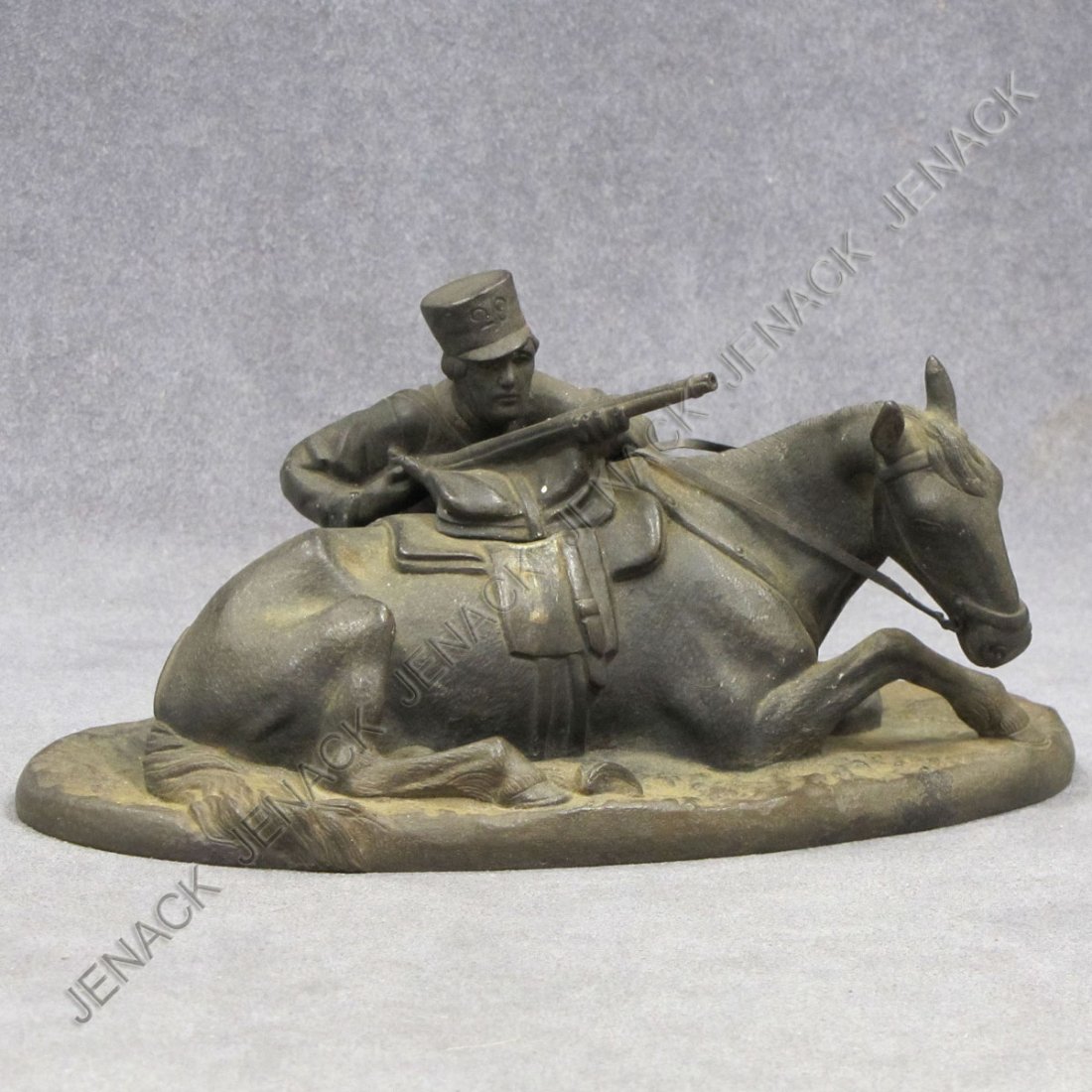 IMPERIAL RUSSIAN CAST IRON FIGURE SOLDIER: IMPERIAL RUSSIAN CAST IRON FIGURE SOLDIER (DRAGOON)/HORSE, SIGNED V. TIMOFEEV (FOUNDRY). HEIGHT 4"; LENGTH 7 1/2"