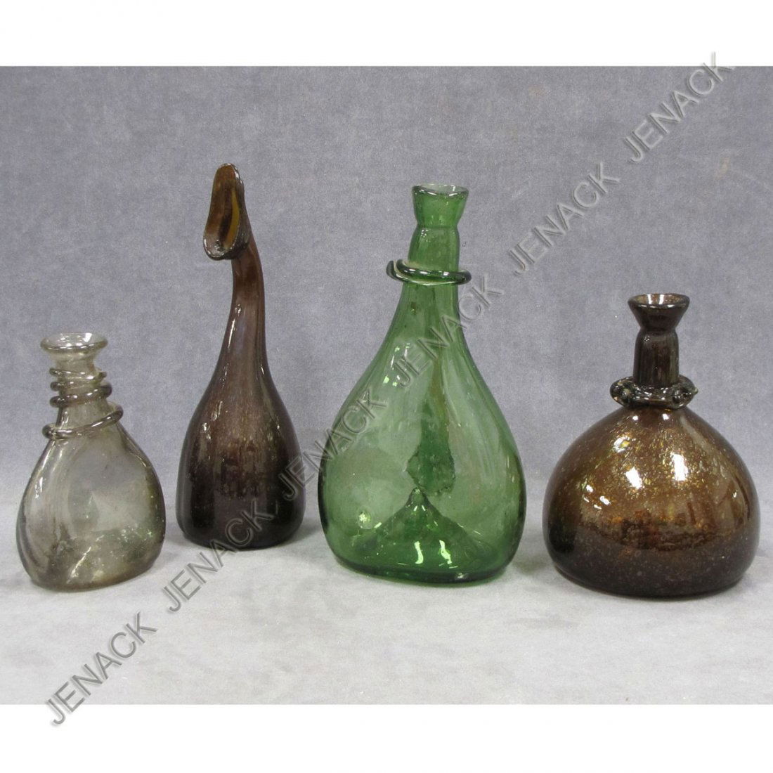 LOT (4) EARLY BLOWN GLASS FLASKS: LOT (4) EARLY BLOWN GLASS FLASKS. HEIGHT 7" TO 11 1/2" (1 WITH IMPERFECTION)