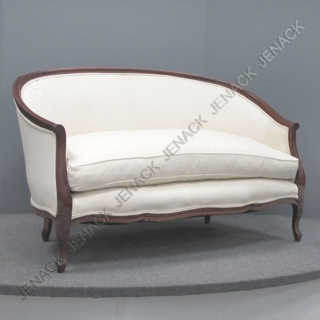 FRENCH STYLE CARVED MAHOGANY FRAME SETTEE: FRENCH STYLE CARVED MAHOGANY FRAME SETTEE WITH DOWN CUSHION. 20TH CENTURY. LENGTH 55"