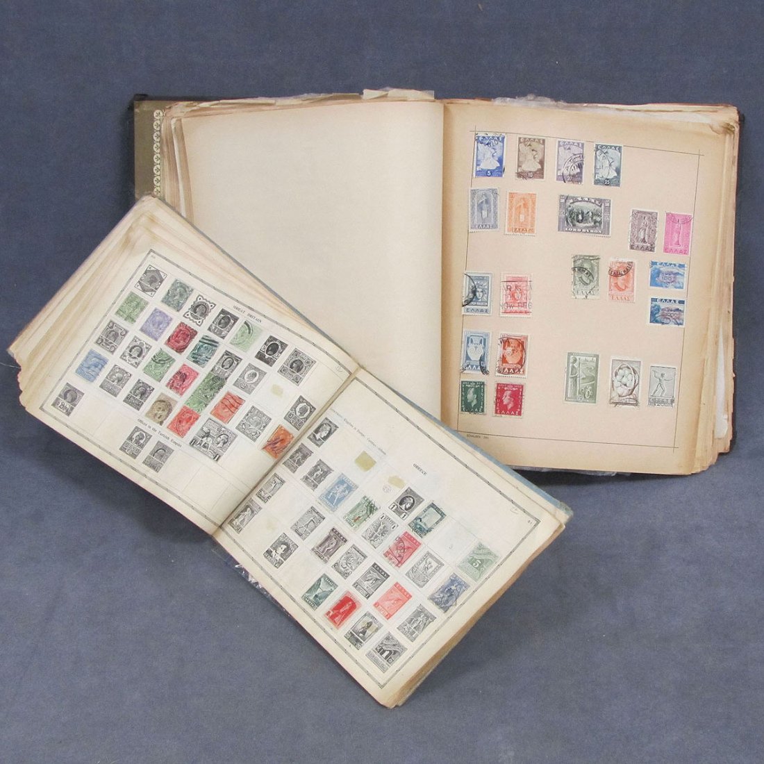LOT (2) ALBUMS INCLUDING SMALL SCOTT IMPERIAL: LOT (2) ALBUMS INCLUDING SMALL SCOTT IMPERIAL JUVENILE ALBUM, C.1928 (FAIR SHOWING MOSTLY HINGED USED AS GENERALLY FOUND; SCAUBEKS SPRINGBACK OLD ALBUM (PAPERS TONED & WORN) MANY 1800 TO 1900 INCLUDIN