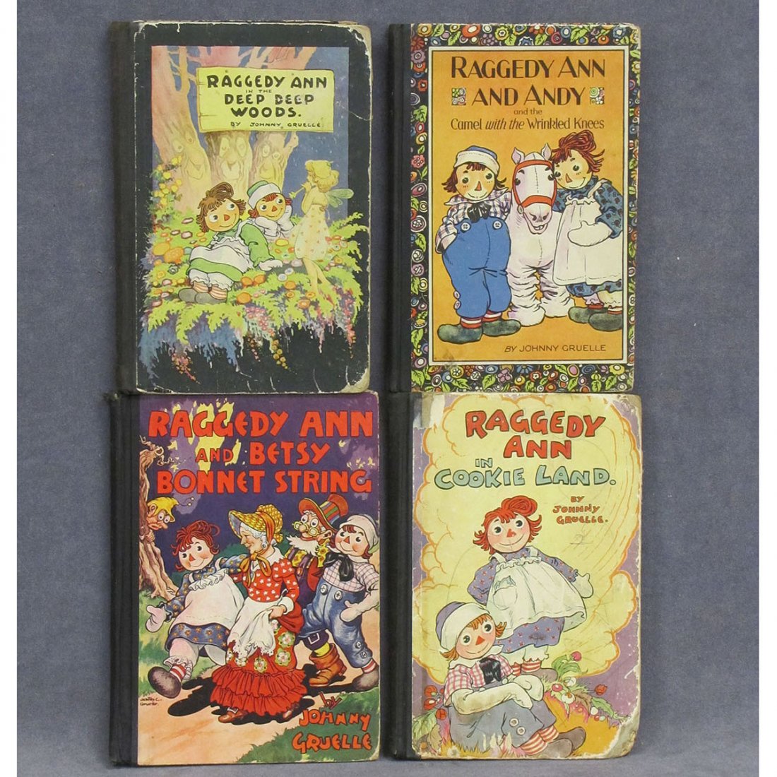 LOT (4) RAGGEDY ANN ILLUSTRATED VOLUMES: LOT (4) RAGGEDY ANN ILLUSTRATED VOLUMES INCLUDING IN THE DEEP WOODS, 1930; IN COOKIE LAND, 1931; BETSY BONNET SPRING, 1943; CAMEL WITH THE WRINKLED KNEE, 1924