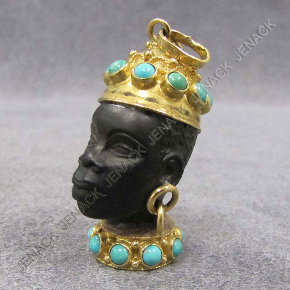 .750 YELLOW GOLD AND TURQUOISE BLACKAMOOR CHARM: .750 YELLOW GOLD AND TURQUOISE MOUNTED EBONY BLACKAMOOR CHARM. LENGTH 1 3/8"; GROSS WEIGHT 18.39 GRAMS (GLUE RESIDUE)