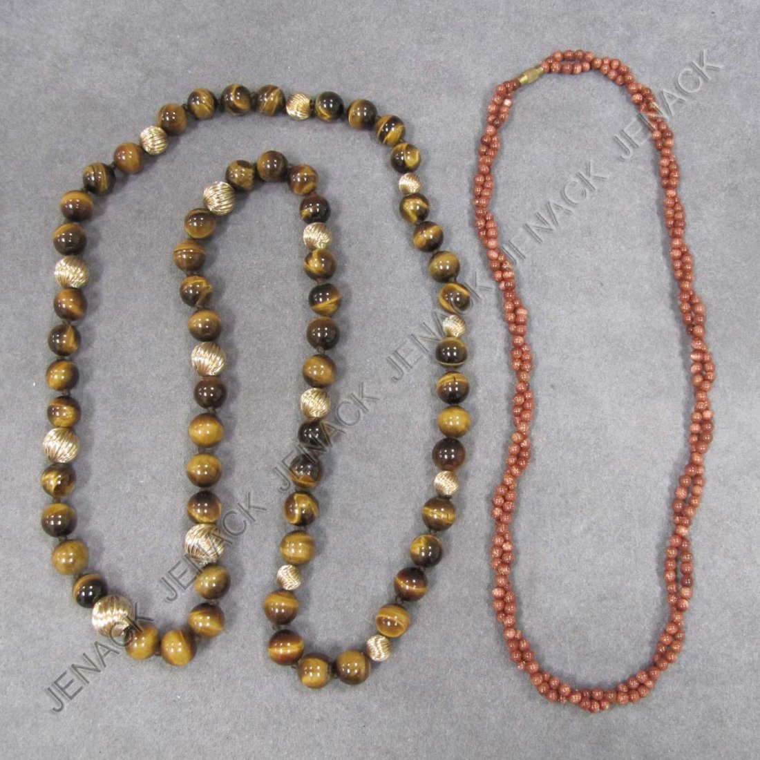 LOT (2) NECKLACES INCLUDING TIGER EYE QUARTZ: LOT (2) NECKLACES INCLUDING TIGER EYE QUARTZ AND YELLOW GOLD (TESTS 14K) BEADS, LENGTH 16"; GOLD STONE BEADED NECKLACE, LENGTH 9 1/2"