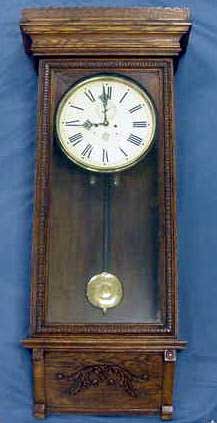 108: WATERBURY OAK #67 WALL CLOCK: WATERBURY OAK #67 WALL CLOCK. HEIGHT 50" CONDITION: THIS IS A LARGE IMPRESSIVE WEIGHT DRIVEN MODEL. THE DIAL HAS A PROPER PAPER REPLACEMENT OVER THE ORIGINAL PAN. ALL ELSE IS ORIGINAL INCLUDING HANDS,