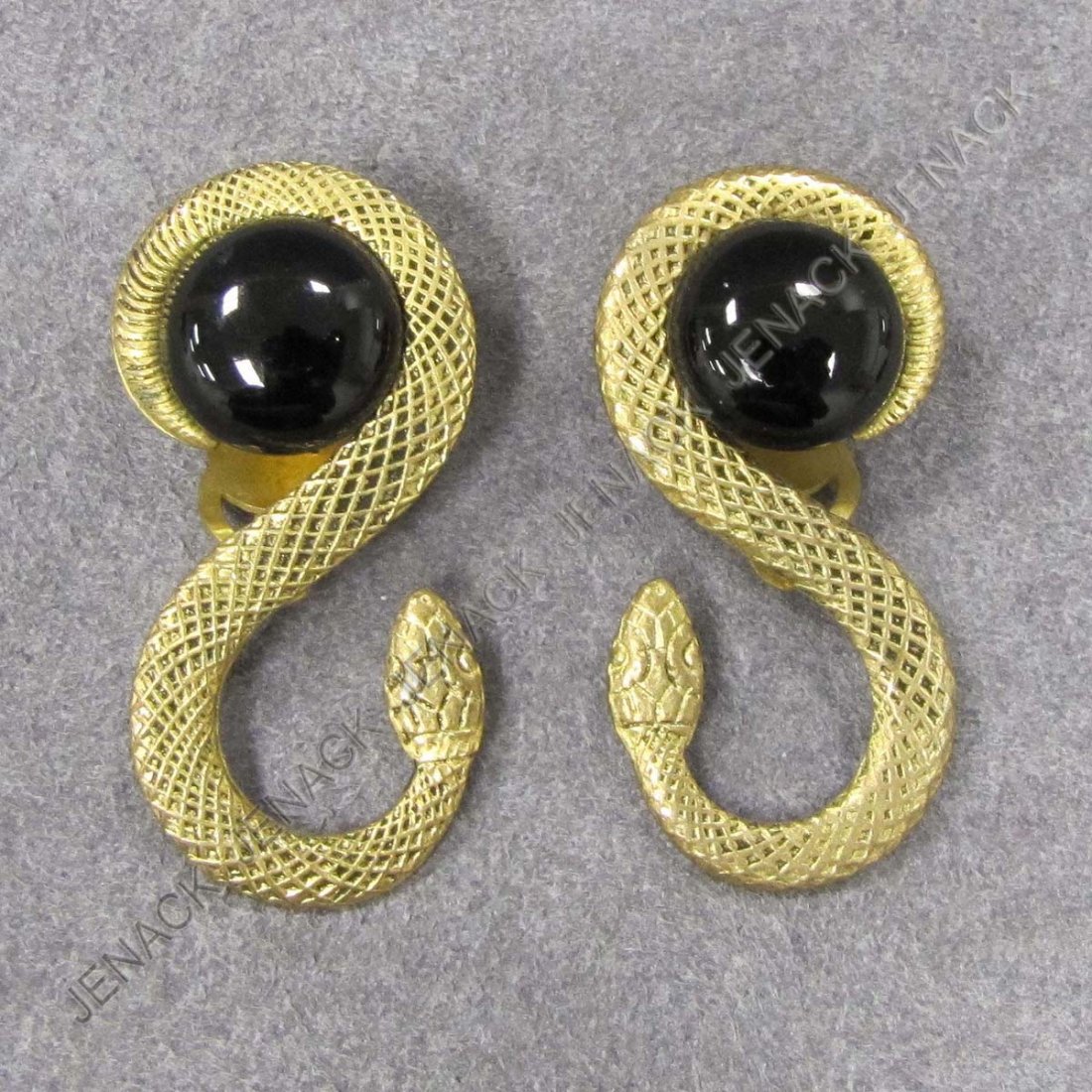 PAIR YVES SAINT LAURENT BRASS SERPENT CLIP EARRING: PAIR YVES SAINT LAURENT BRASS SERPENT CLIP EARRINGS, SIGNED. LENGTH 1 3/4"