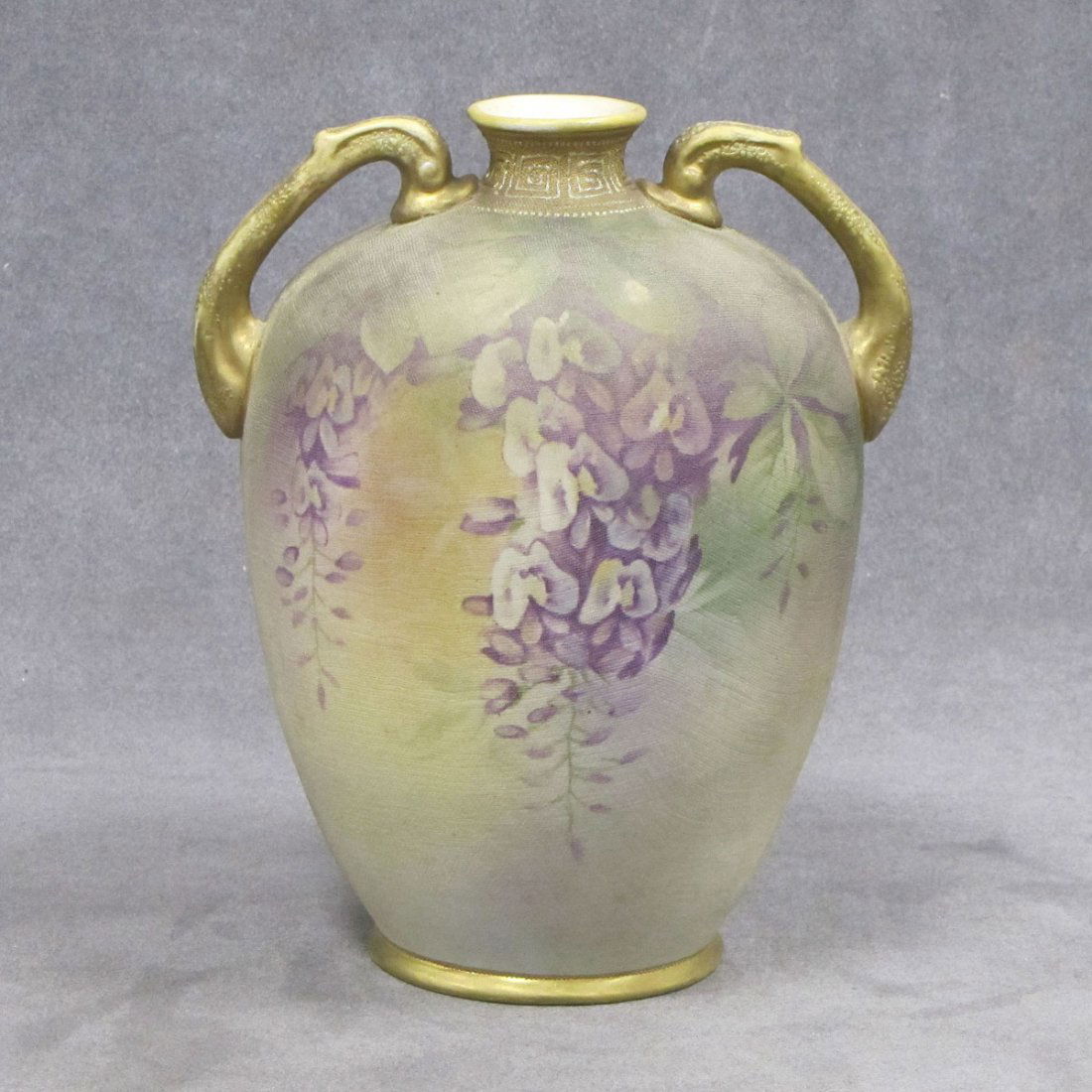 HAND PAINTED NIPPON TAPESTRY DOUBLE HANDLE VASE: HAND PAINTED NIPPON TAPESTRY DOUBLE HANDLE PORCELAIN VASE. HEIGHT 8"