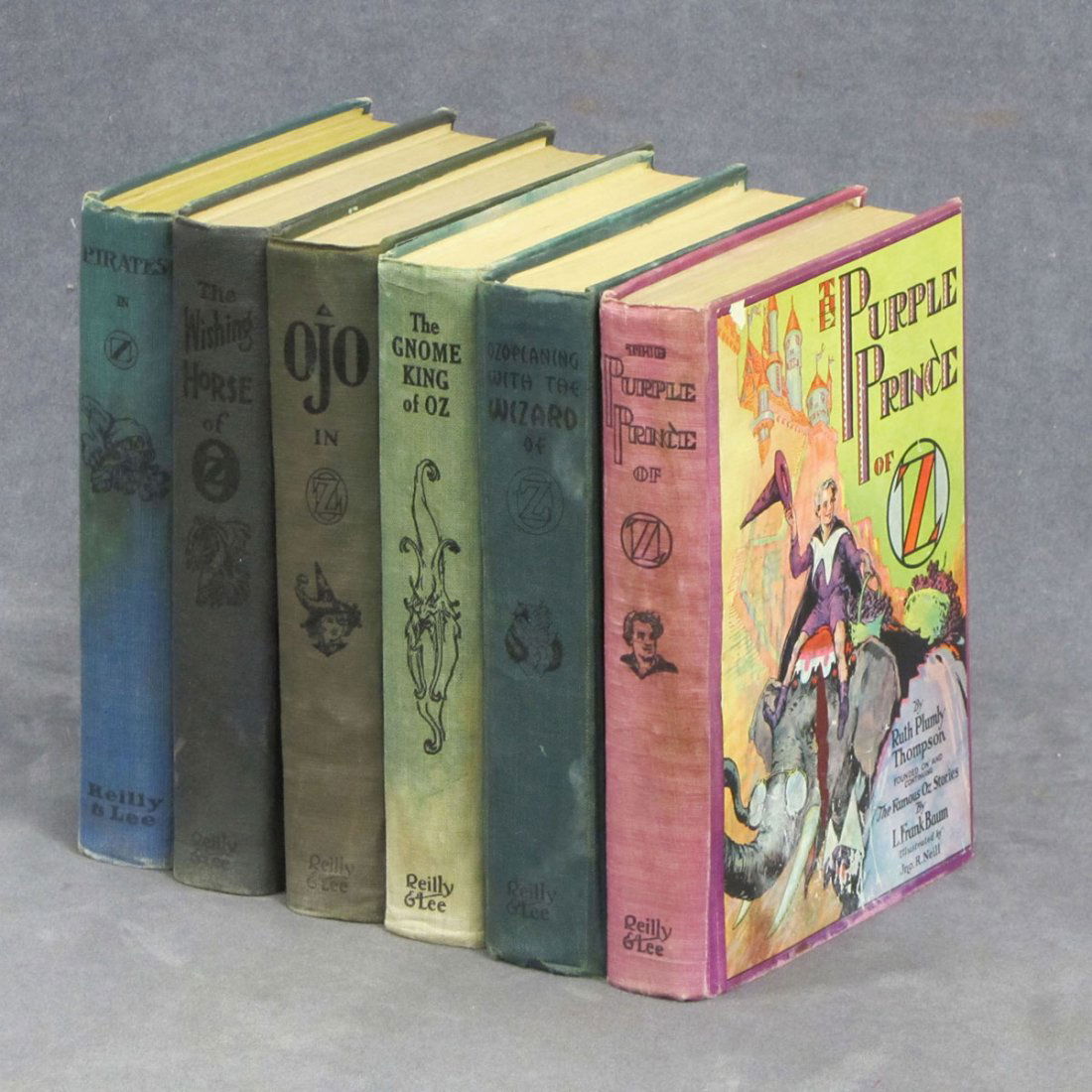 RUTH PLUMLY THOMPSON/FRANK L. BAUM, LOT (6) VOLUMES: RUTH PLUMLY THOMPSON/FRANK L. BAUM, LOT (6) VOLUMES INCLUDING PIRATES IN OZ, 1931; THE WISHING HORSE OF OZ, 1935; OJO IN OZ, 1933; THE GNOME KING OF OZ, 1927; OZOPLANING WITH THE WIZARD OF OZ, 1939; T