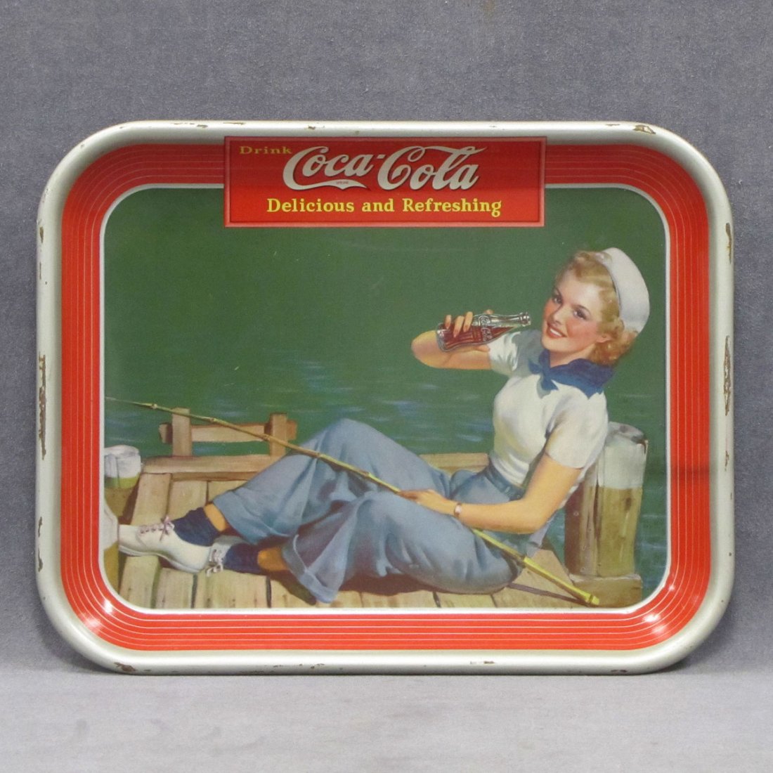 1940 COCA-COLA SERVING TRAY, LITHO/METAL, SIGNED : 1940 COCA-COLA SERVING TRAY, LITHO/METAL, SIGNED AMERICAN ART WORKS INC, COSHOCTON, OHIO. 10 1/2 X 13 1/4"