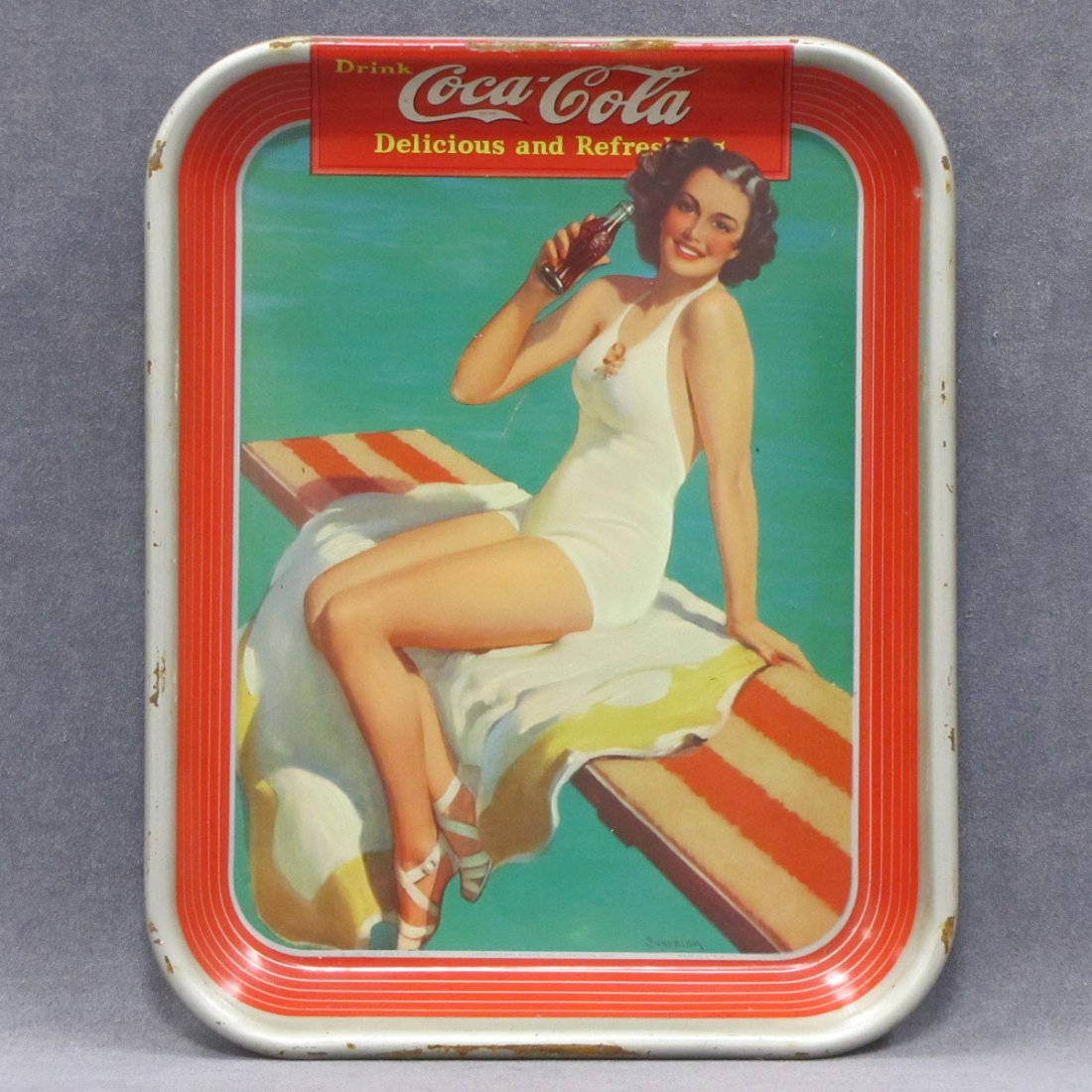 1939 COCA-COLA SERVING TRAY, LITHO/METAL, SIGNED : 1939 COCA-COLA SERVING TRAY, LITHO/METAL, SIGNED AMERICAN ART WORKS INC, COSHOCTON, OHIO. 13 1/4 X 10 1/2"