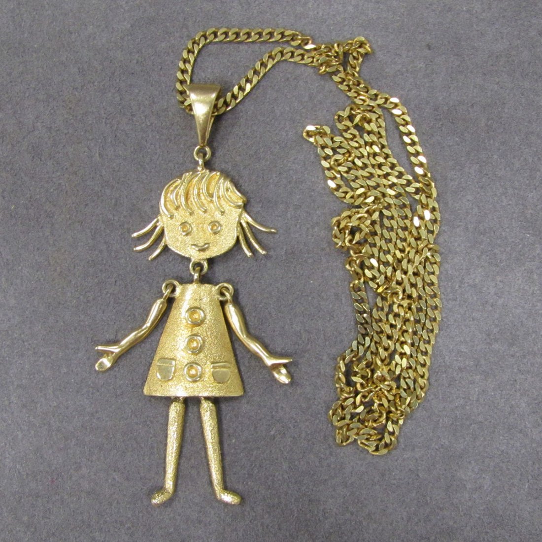 14K YELLOW GOLD PENDANT, YOUNG GIRL : 14K YELLOW GOLD PENDANT, YOUNG GIRL WITH MOVEABLE ARMS AND LEGS, LENGTH 3 5/8" WITH FLAT YELLOW GOLD LINK CHAIN (TESTS 14K), LENGTH 30"; TWT 47.18 GRAMS