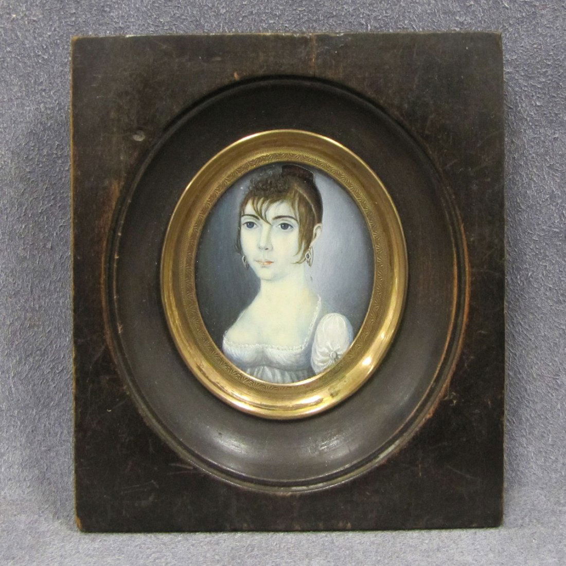 FRENCH SCHOOL (19TH CENTURY) PORTRAIT MINIATURE: FRENCH SCHOOL (19TH CENTURY) WATERCOLOR ON IVORY, PORTRAIT MINIATURE OF A WOMAN. 1 3/4 X 1 3/8"; FRAMED 3 3/4 X 3 1/4" **CANNOT EXPORT** DEC #16-34