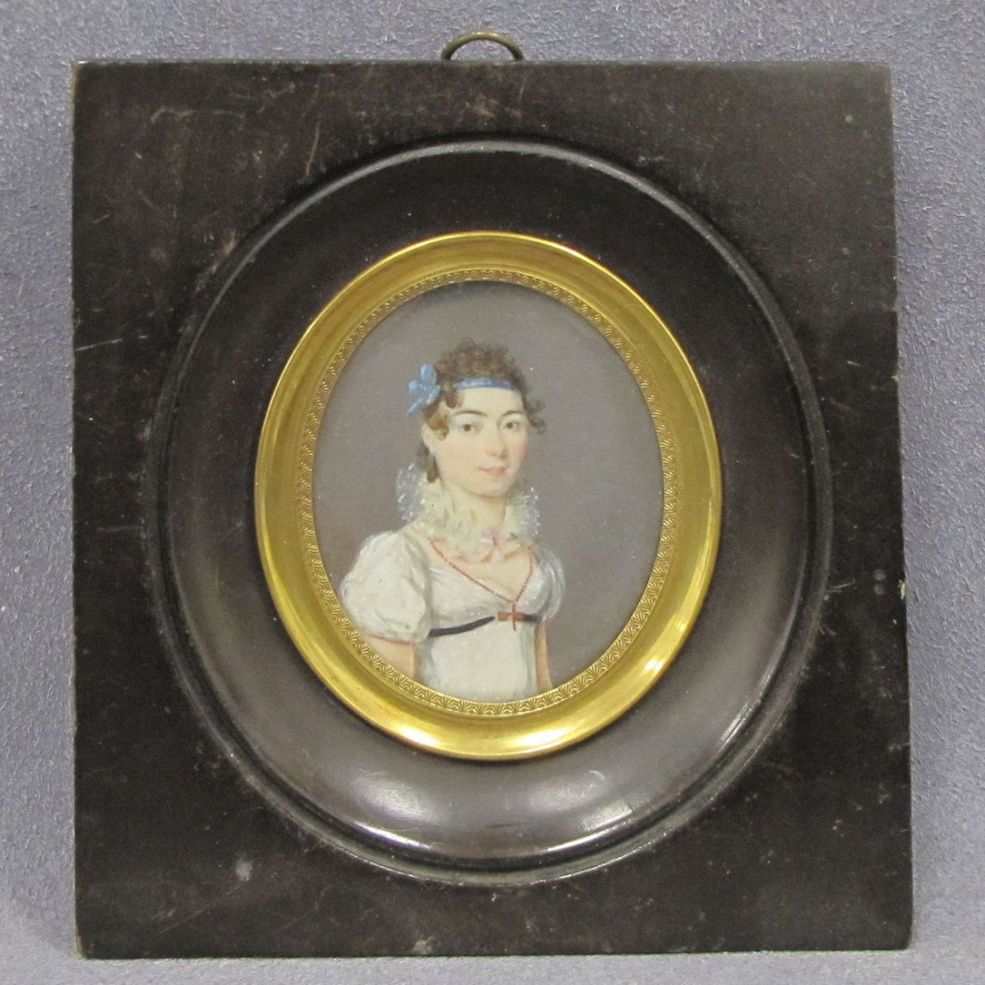 FRENCH SCHOOL (19TH CENTURY) PORTRAIT MINIATURE: FRENCH SCHOOL (19TH CENTURY) WATERCOLOR ON IVORY, PORTRAIT MINIATURE OF A YOUNG WOMAN. 2 1/8 X 15/8"; FRAMED 4 1/2 X 4" **CANNOT EXPORT** DEC #16-31