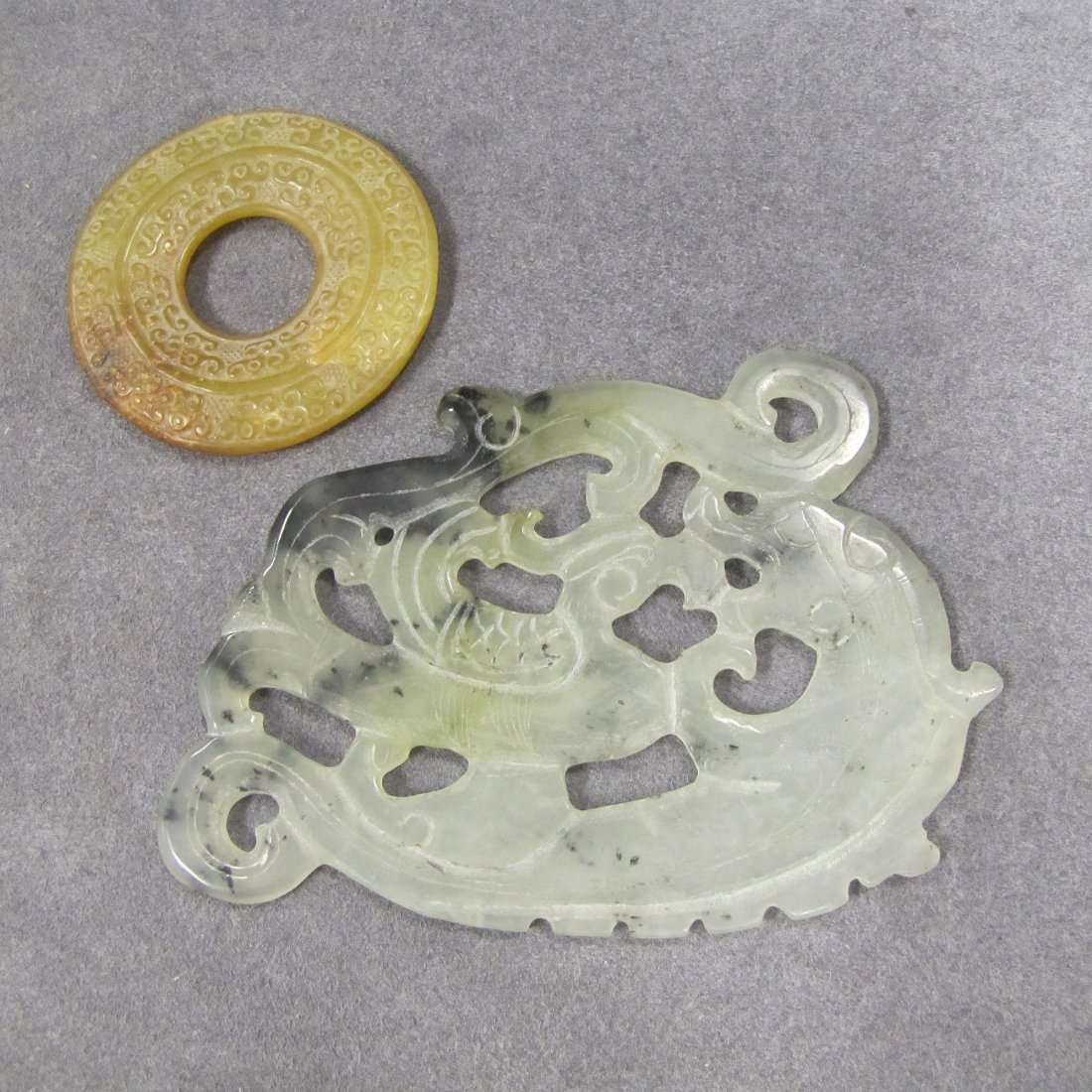 LOT (2) CHINESE ARCHAIC STYLE CARVED JADE PLAQUES: LOT (2) CHINESE ARCHAIC STYLE CARVED JADE PLAQUES. 3 1/2 X 5" AND DIAMETER 2 1/2"