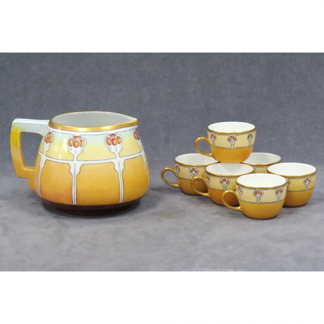 ARTS & CRAFTS HAND PAINTED PORCELAIN CIDER SET (7): ARTS & CRAFTS HAND PAINTED PORCELAIN CIDER SET (7), SIGNED AMB 1911/1915. PITCHER/HEIGHT 6"