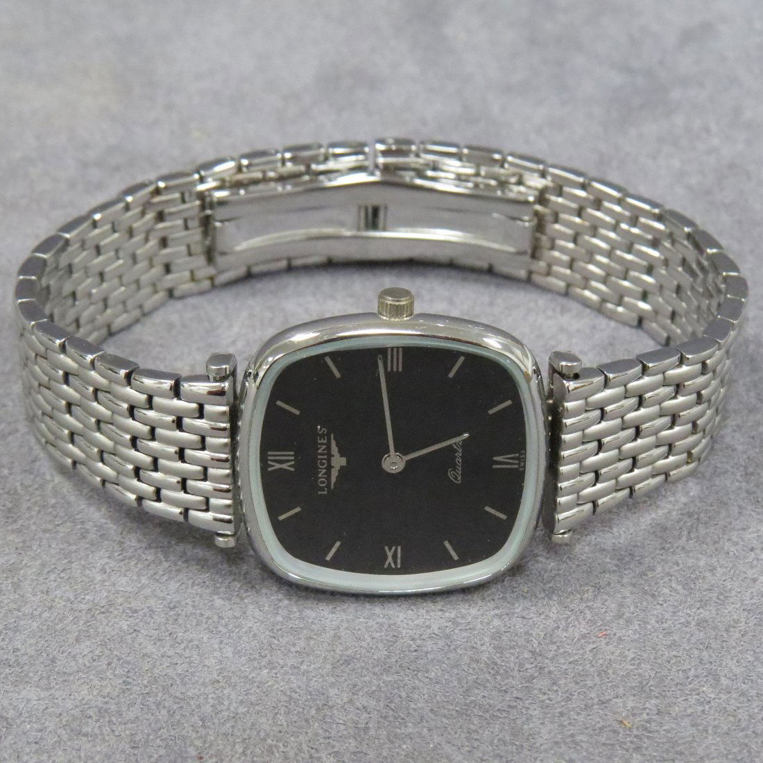 LONGINES STAINLESS STEEL QUARTZ WRISTWATCH: LONGINES STAINLESS STEEL QUARTZ WRISTWATCH, #99235 WITH BRACELET BAND. LENGTH 32MM