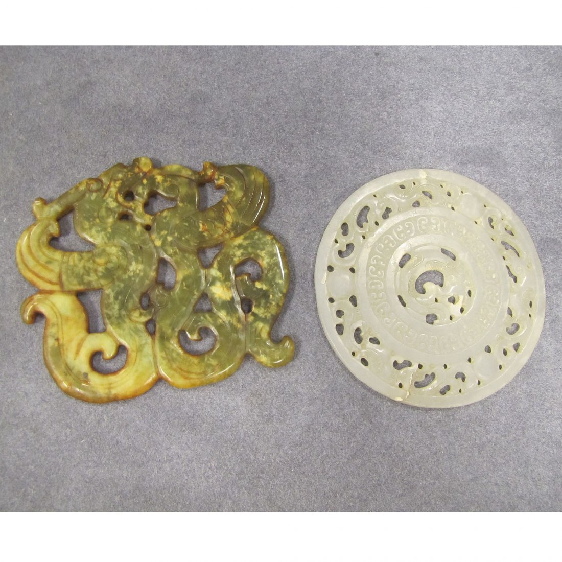 LOT (2) CHINESE ARCHAIC STYLE CARVED JADE PLAQUES: LOT (2) CHINESE ARCHAIC STYLE CARVED JADE PLAQUES. 3 5/8 X 4"; DIAMETER 3 3/4"
