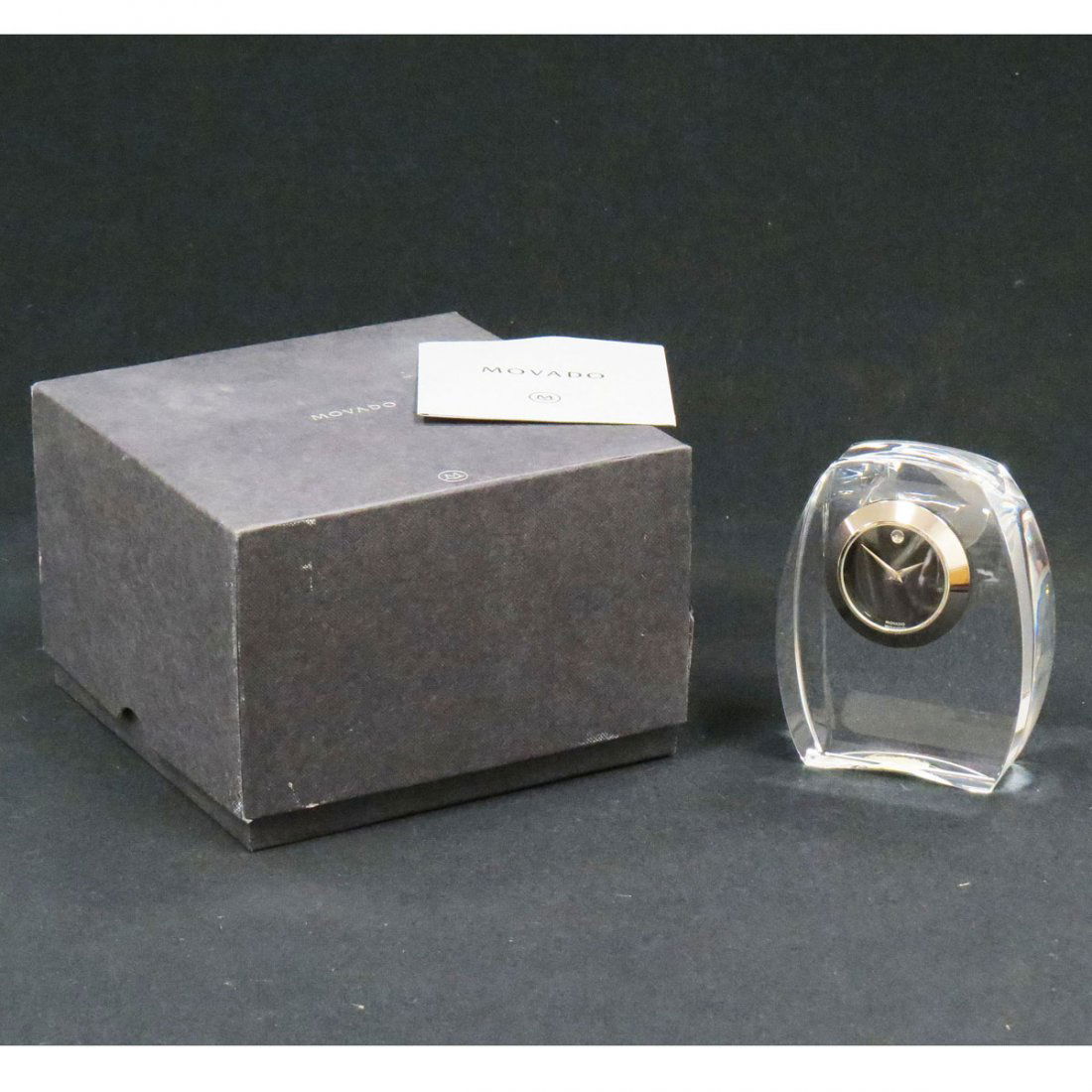 MOVADO CRYSTAL MINIATURE QUARTZ DESK CLOCK: MOVADO CRYSTAL MINIATURE QUARTZ DESK CLOCK. HEIGHT 3 3/4" (BOXED)