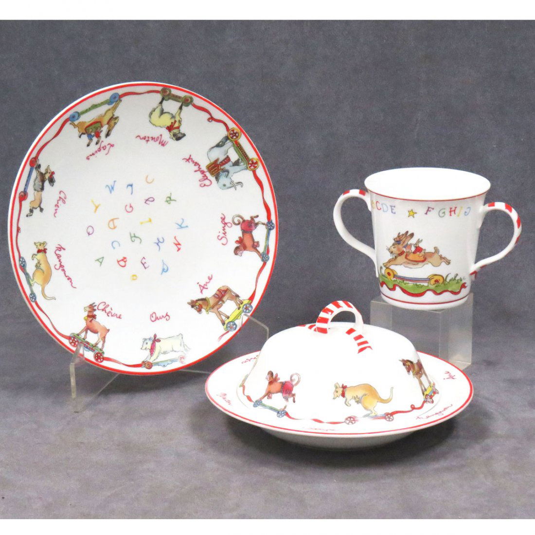 LOT (3) LIMOGES "BERNARDAUD" LA RONDE DES JOUETS": LOT (3) LIMOGES "BERNARDAUD" LA RONDE DES JOUETS" CHILD'S DINNER SET INCLUDING DOUBLE HANDLED CUP, HEIGHT 3 1/2"; COVERED BOWL, DIAMETER 7 1/4"; PLATE, DIAMETER 8 1/4"
